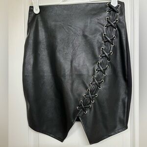 Revamped faux leather front mini skirt, faux criss cross detail design in front